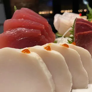 a variety of sushi on a white plate