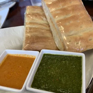 Green sauce (Chatni) and a spicy sauce that pairs well with the Potato Bolani... and everything else lol