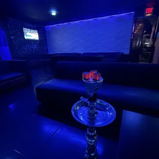 a hookah lounge with blue lighting