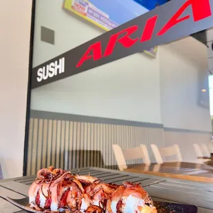 Chef&apos;s Albacore Roll with crispy onions, albacore, spicy tuna dressed in spicy mustard dressing.