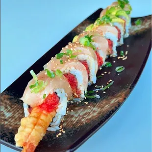 Yuzu Roll with spicy tuna, shrimp tempura, and albacore.