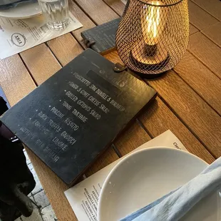 a menu and a glass of water