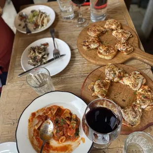 a table of food and wine glasses