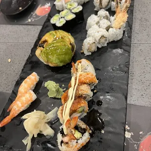 Spicy tuna roll, avocado ball, and assorted sushi