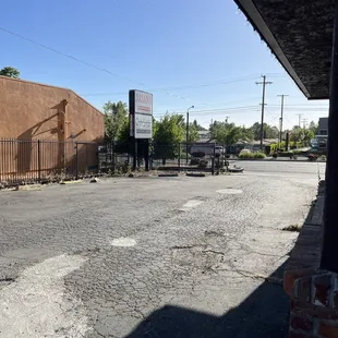 Entrance to private parking lot from street.