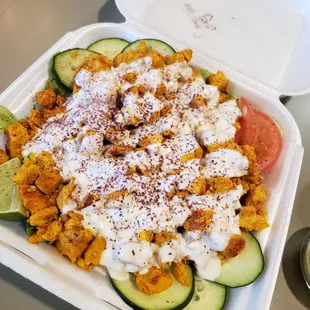 a meal in a styrofoam container