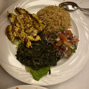 Mourgh Kabob- tender grilled chicken breast with a side of spinach, Pallow, and salad.