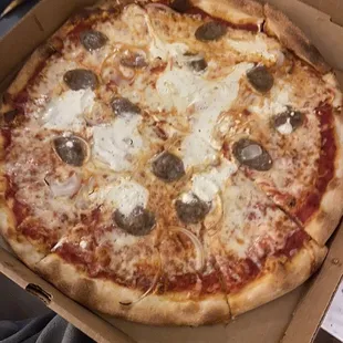 Pizza with ricotta, sausage, &amp; onions.