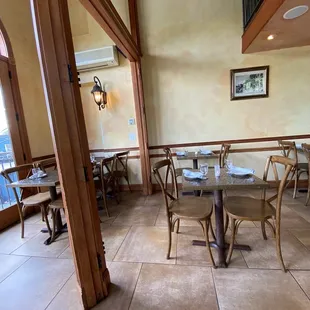 a dining room with tables and chairs