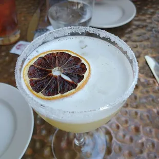 a close up of a drink in a coupe glass