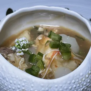 Stone Crab, jalapeno, in a seafood broth, served warm.