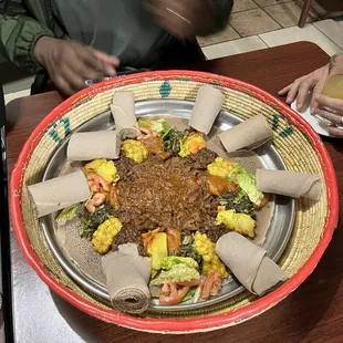 Beef, enjera corn and potatoes