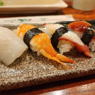 Trying to demonstrate that the nigiri slices are unacceptably thin. If I were this level of thin, I'd be malnourished.