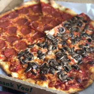 two slices of pizza in a box