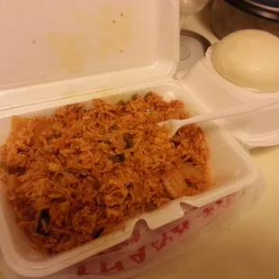 Korean stir fry with chicken rice vegetable and kimchi. Stuffed hot bread