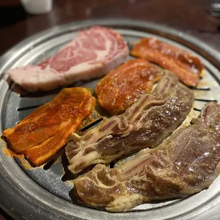 Spicy pork belly, marinated short ribs and ribeye