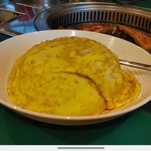 Kimchi fried rice covered in egg