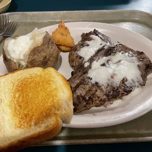 18oz T-bone steak medium rare with extra butter, shrimp, potato and toast. Delicious.