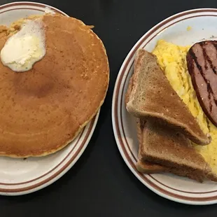 Sampler platter with scrambled eggs, ham, toast and a pancake !