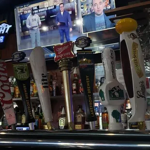 a row of beer taps