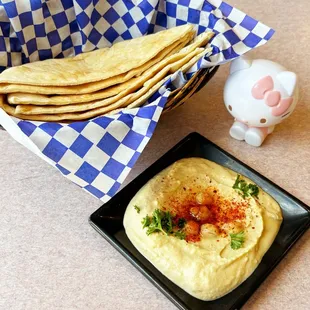Complimentary hummus and pita bread