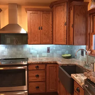 Spacious corner cabinet above counter top and lazy susan type cabinet below offer tons of storage.
