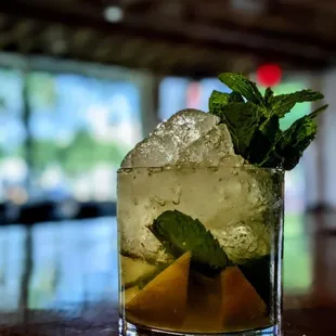 a drink with ice and mint