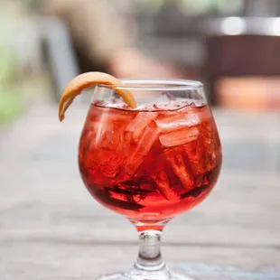 a drink in a glass on a table
