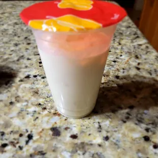 a yogurt in a plastic cup