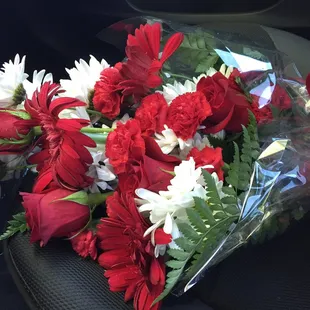 Red and white presentation bouquet for a Tucson High School event.