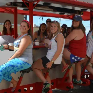 a group of women on a bike