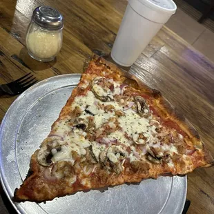 a slice of pizza on a plate