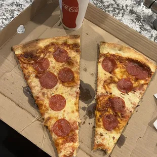 1 lunch special pizza slice cut in half and taken to-go! It had the end but I got hungry before the picture.