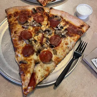 Pepperoni and mushroom. Fork to show size.