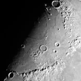 High power view of mountain ranges on the Moon, captured with cellphone.