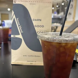 a drink in a plastic cup with a straw