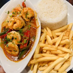 Our signature Shrimp creole served with rice and fries! / Enchilada de Camarones servido con arroz y papas