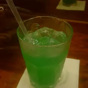 a green drink in a glass