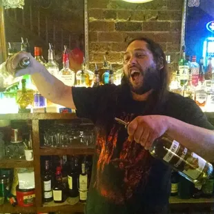 a man pouring a drink