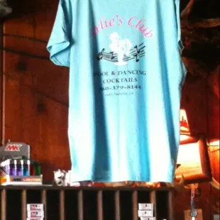 a t - shirt hanging on a rack