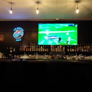 a bar with a large screen