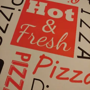 a pizza box with the words hot and fresh on it