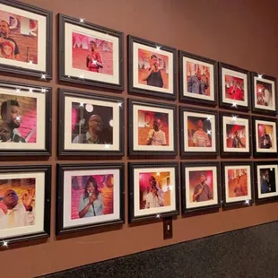 a wall of framed photos
