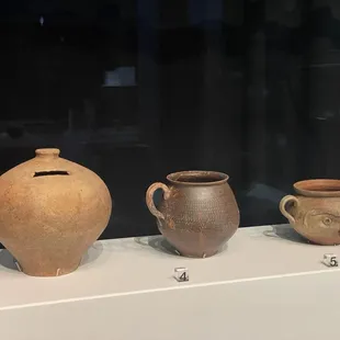 Item on left is a piggy bank from 62 AD!