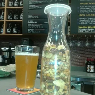 a pitcher of beer and a glass of beer