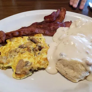 Half order biscuits and gravy with mushrooms added to the eggs