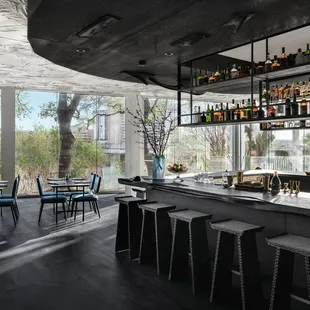 Hand-carved wood bar, sweeping through Arlo Grey