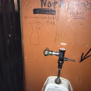 Sign says this is not a wishing well! Also says there IS a wishing well at the bar (tip jar!!)