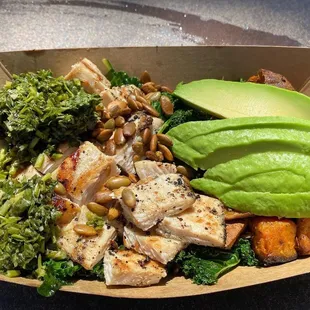 a bowl of food with avocado