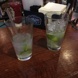 two cocktails on a bar